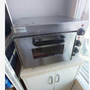 Commercial Electric Pizza Oven with stainless steel finish, featuring a 2500W power output and stone baking board, perfect for making delicious pizzas at home or in a restaurant.