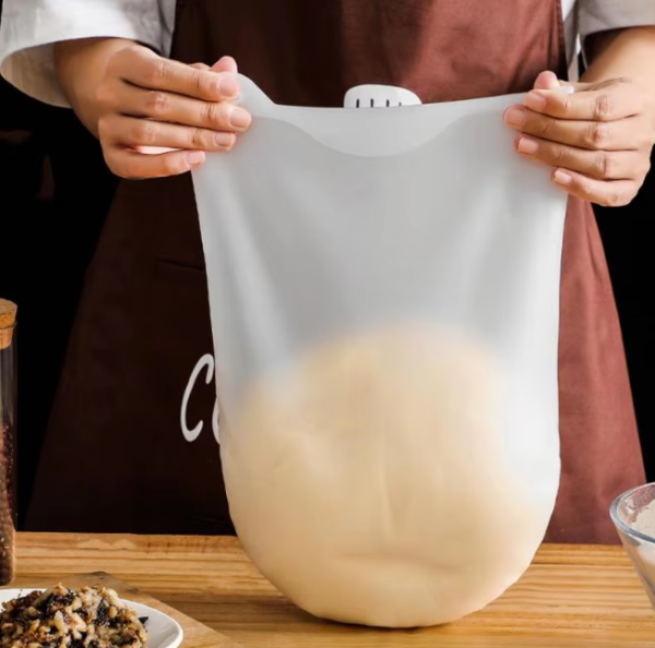 Magic Silicone Kneading Dough Bag in white, perfect for kneading dough, marinating meats, and easy cleanup in the kitchen.