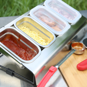 Stainless steel pizza topping station with tilt-angle design, featuring PP lids for fridge storage and organized ingredient prep.